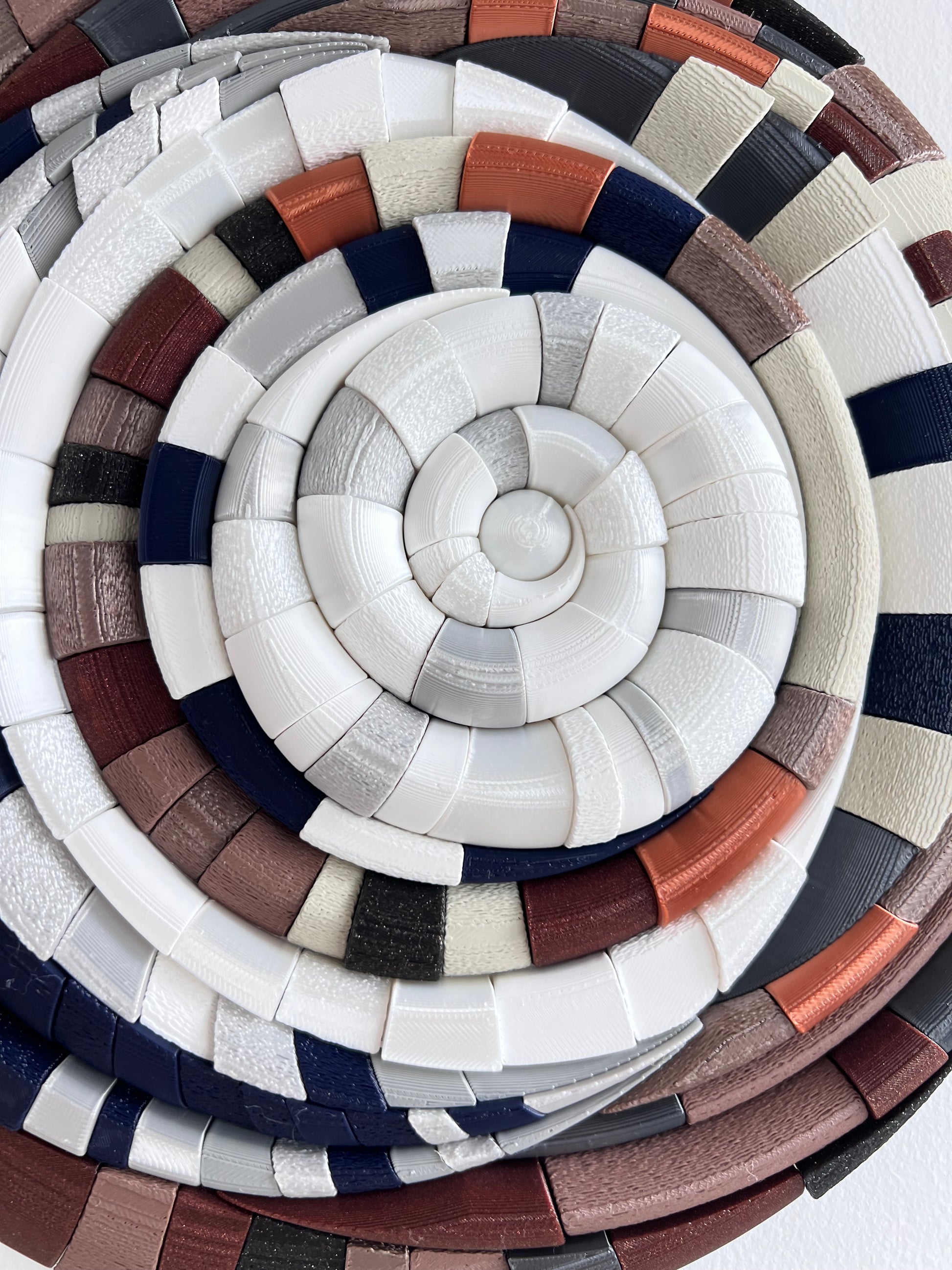 Close-up of Mosaic Moon Brown showing exclusive design with shimmering silver and copper accents